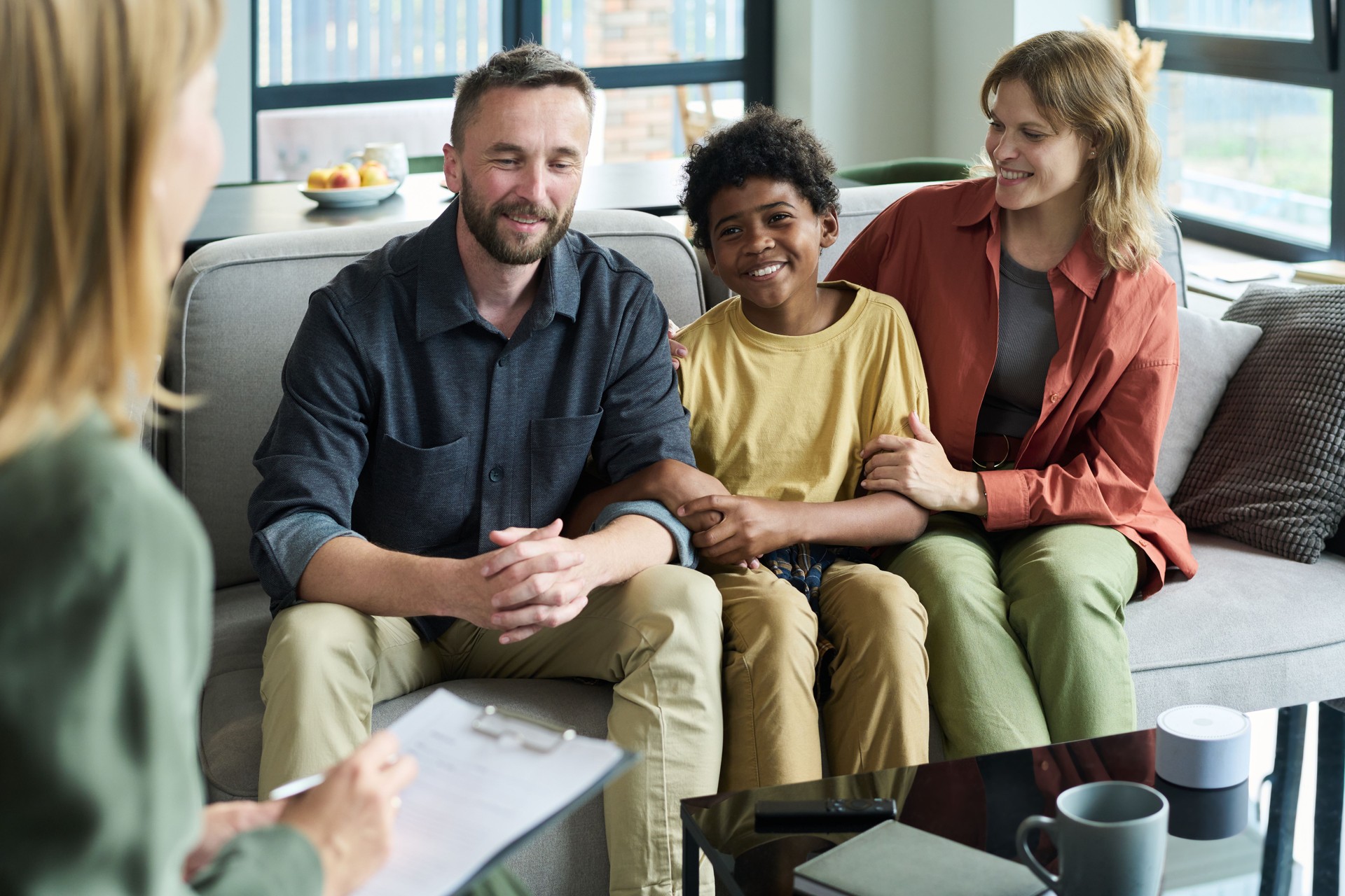 Counseling Session with Happy Multiracial Family Smiling Together